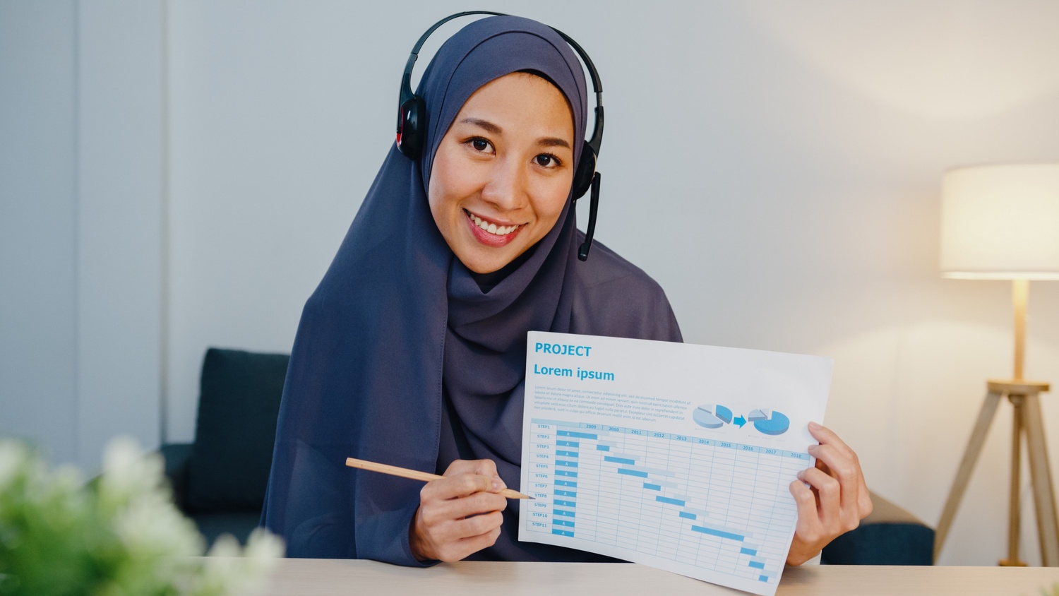 muslim-lady-using-laptop-talk-to-colleagues-in-vid-9YBZ8E8